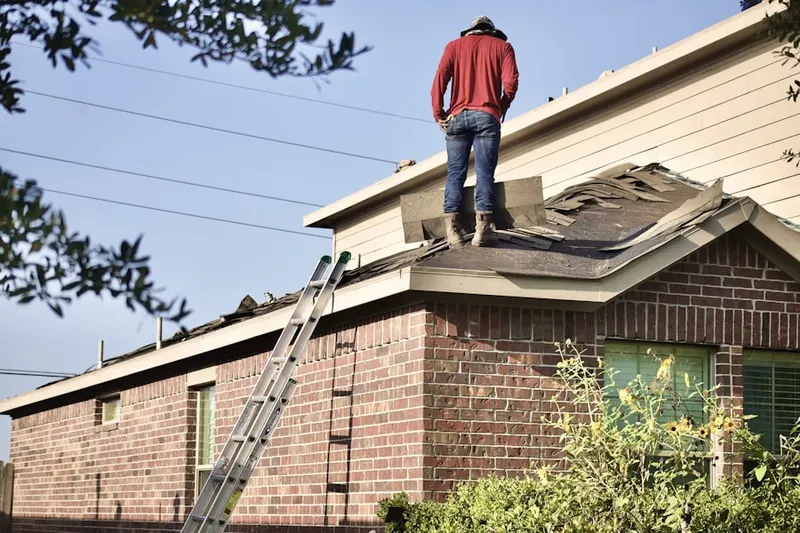 Professional roofer working on a residential roof in Burbank